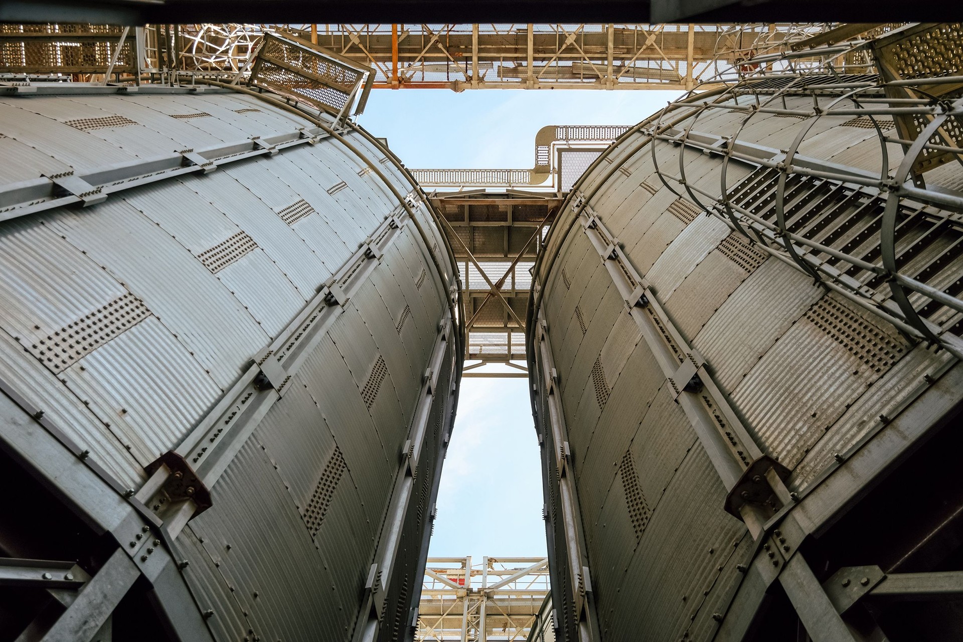Silo Grain bins view from bottom to top. Grain dryer complex. Granary with loading tower.